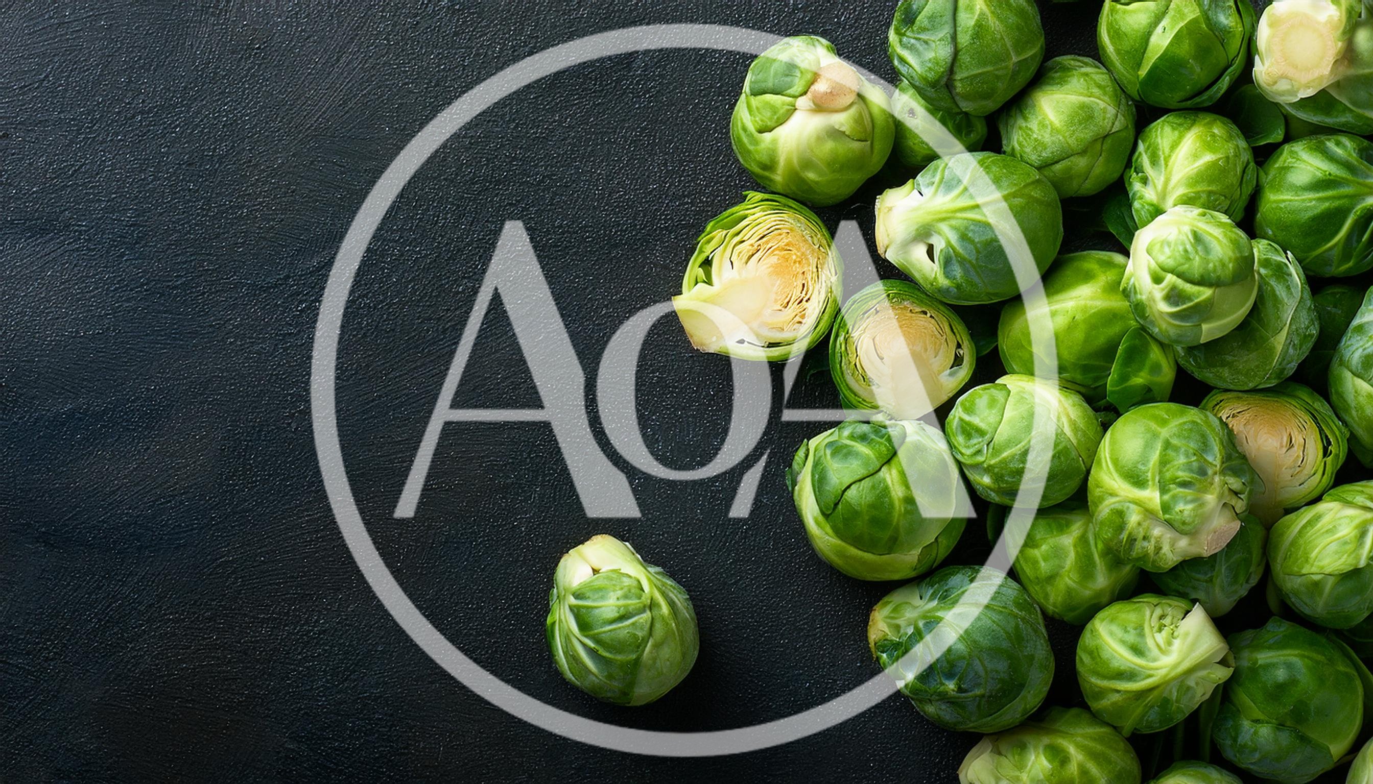 Fresh Green Brussels Sprouts on Dark Textured Background