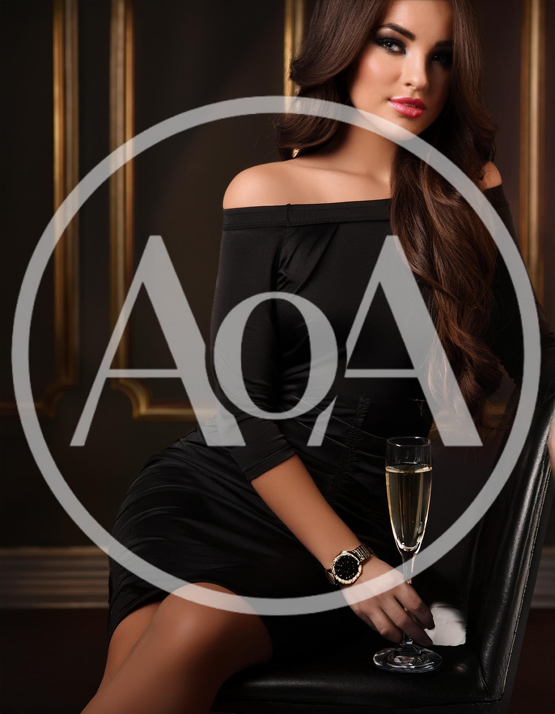 Elegant Woman Holding Champagne Glass In Luxury Interior
