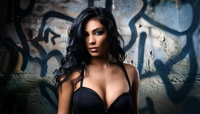 Portrait Of A Beautiful Woman Against Graffiti Wall