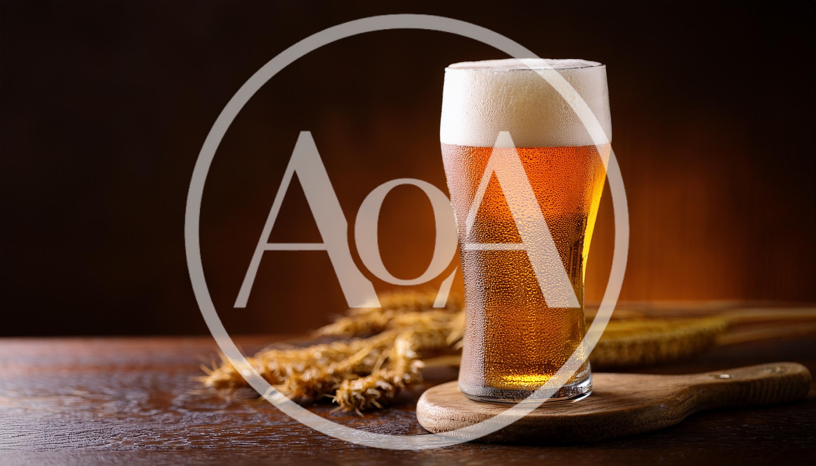 Cold Glass Of Beer With Wheat Stalks