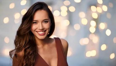 Portrait Of A Smiling Young Woman With Long Hair