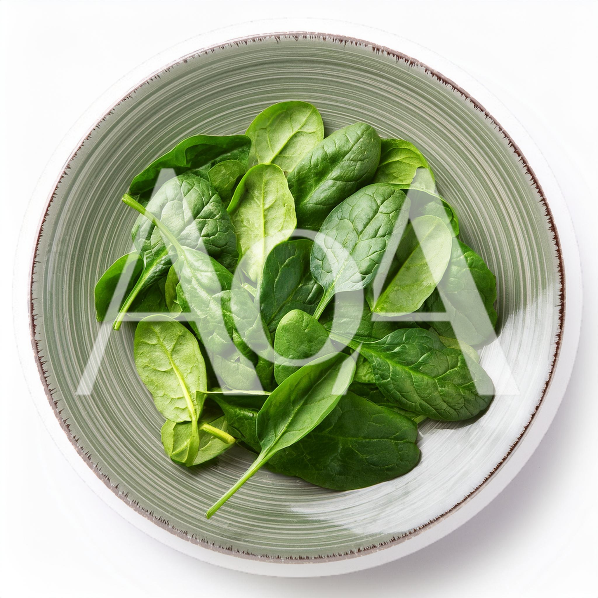 Fresh Green Spinach Leaves In A Ceramic Bowl