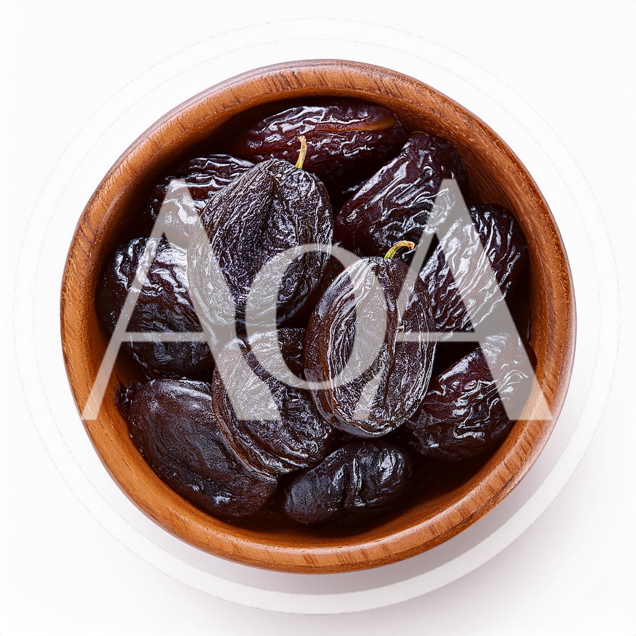 Dried Prunes In A Wooden Bowl