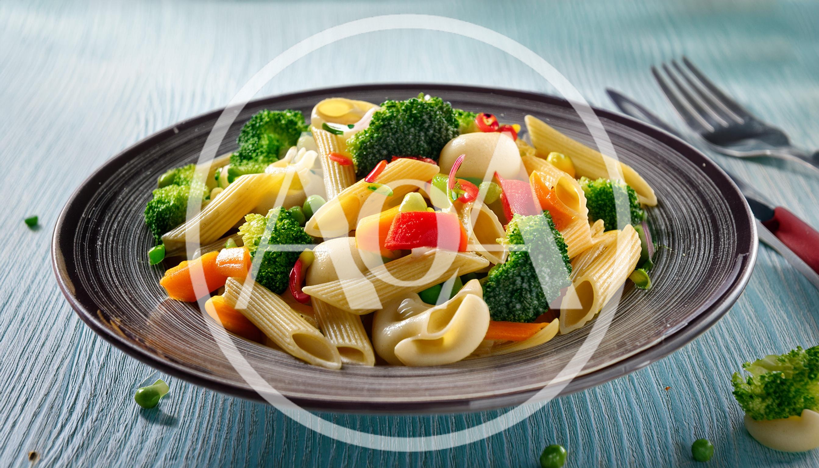 Penne Pasta Salad With Fresh Vegetables On Plate