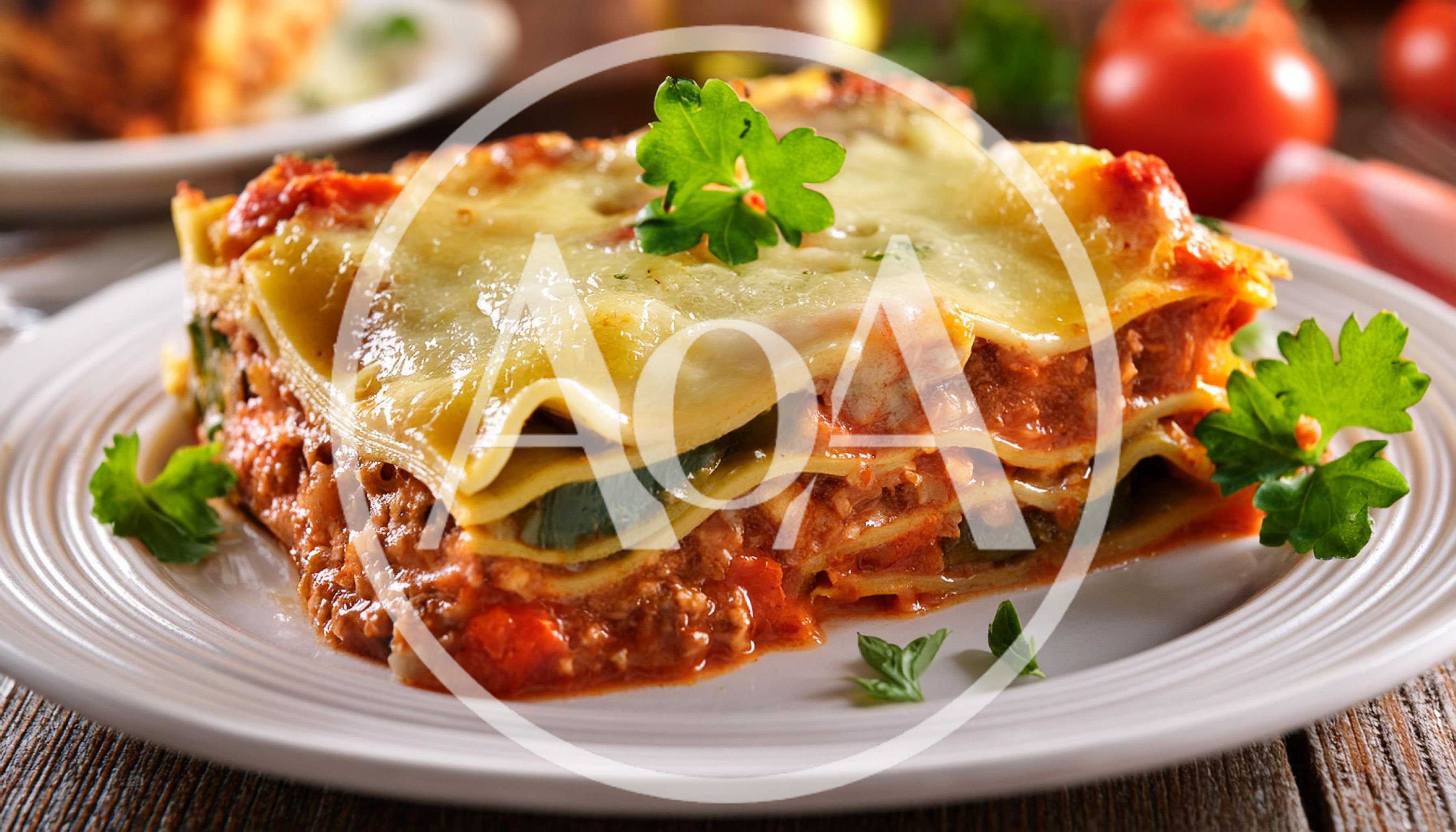 Freshly Baked Lasagna Slice On A White Plate