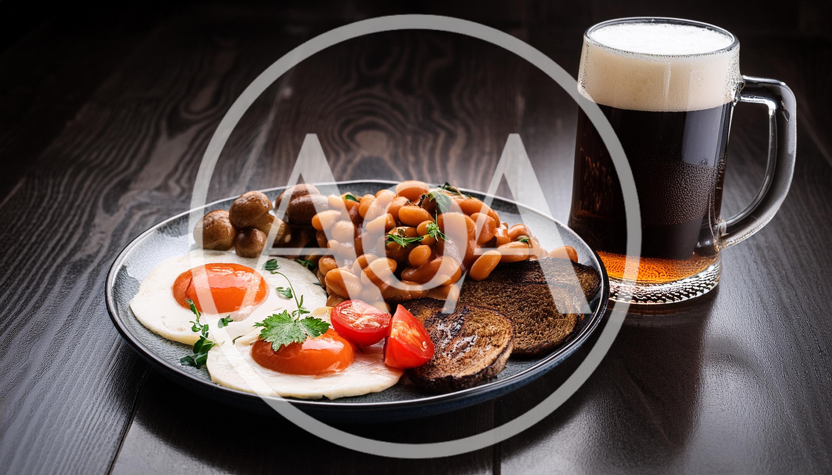 Full English Breakfast With Dark Beer On Wooden Table
