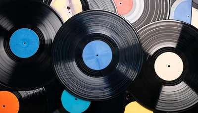 Collection Of Vintage Vinyl Records Stacked Together
