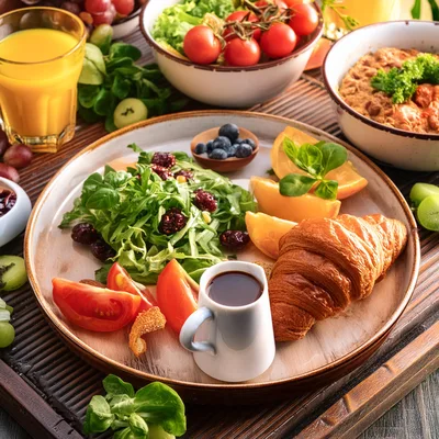 Gourmet Breakfast Platter With Croissant And Fresh Salad