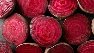 Fresh Sliced Red Beetroot Halves On Dark Background