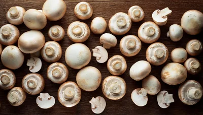 Fresh White Button Mushrooms On Wooden Table