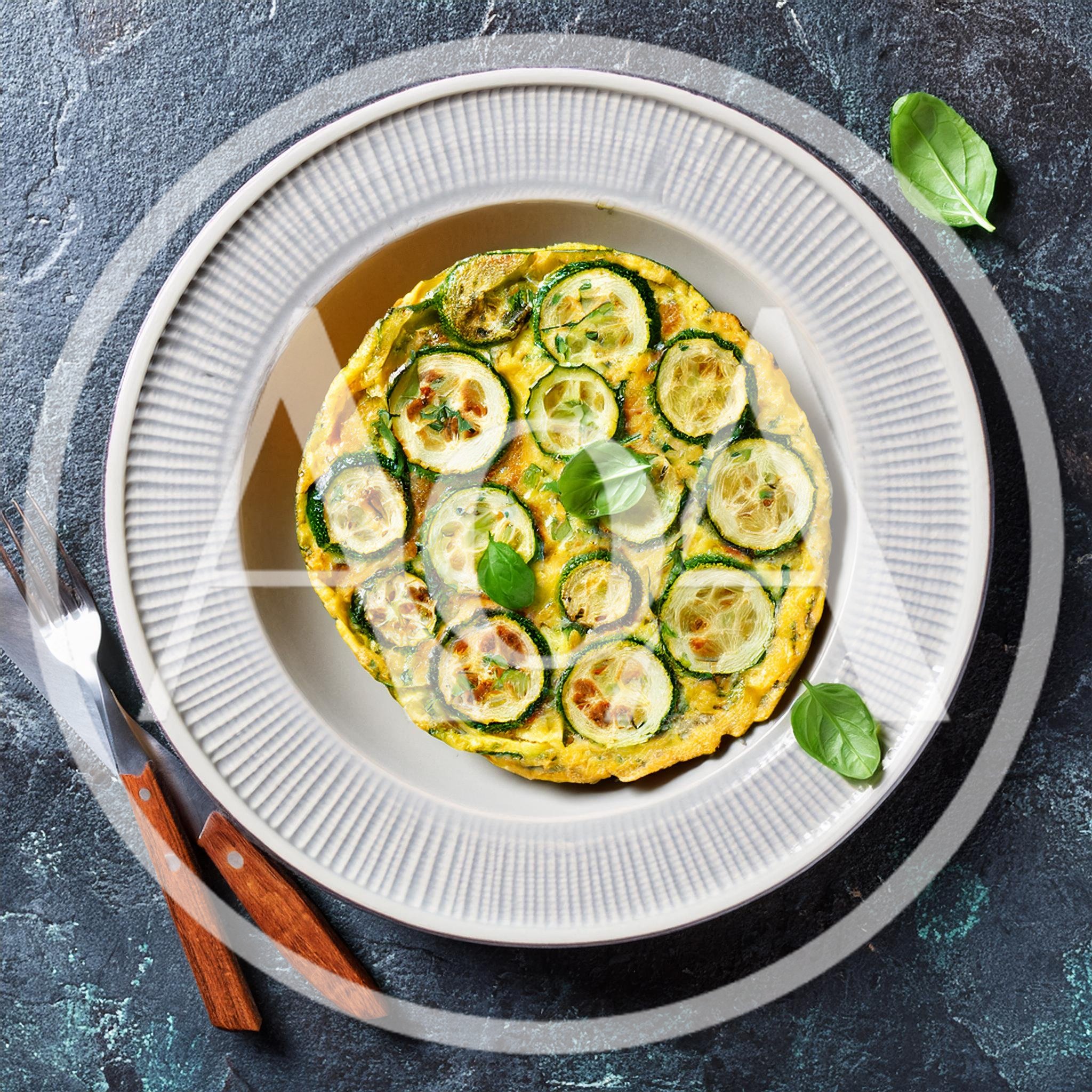 Zucchini Frittata Served On A Plate With Cutlery