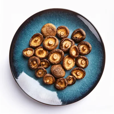 Dried Shiitake Mushrooms Arranged on a Blue Ceramic Plate