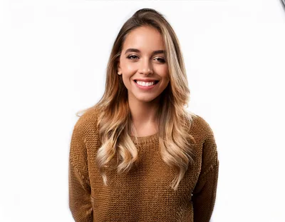 Smiling Young Woman In Brown Sweater
