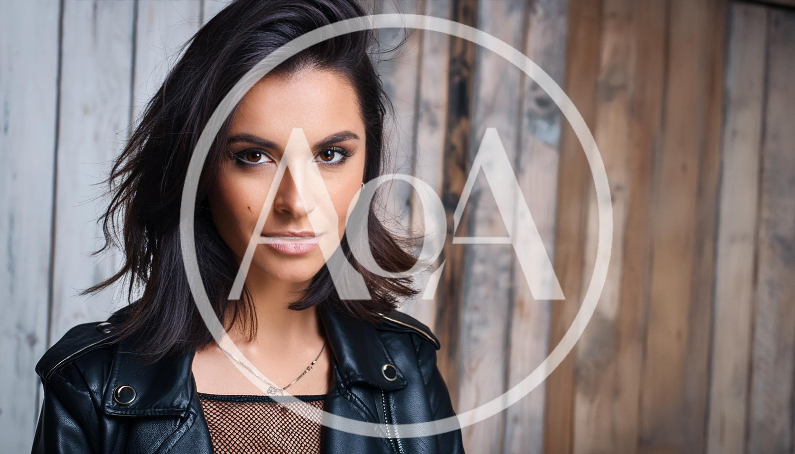 Portrait Of A Stylish Woman In Leather Jacket