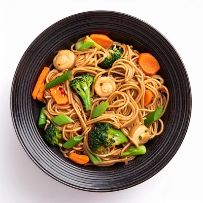 Stir Fried Noodles With Vegetables In Black Bowl