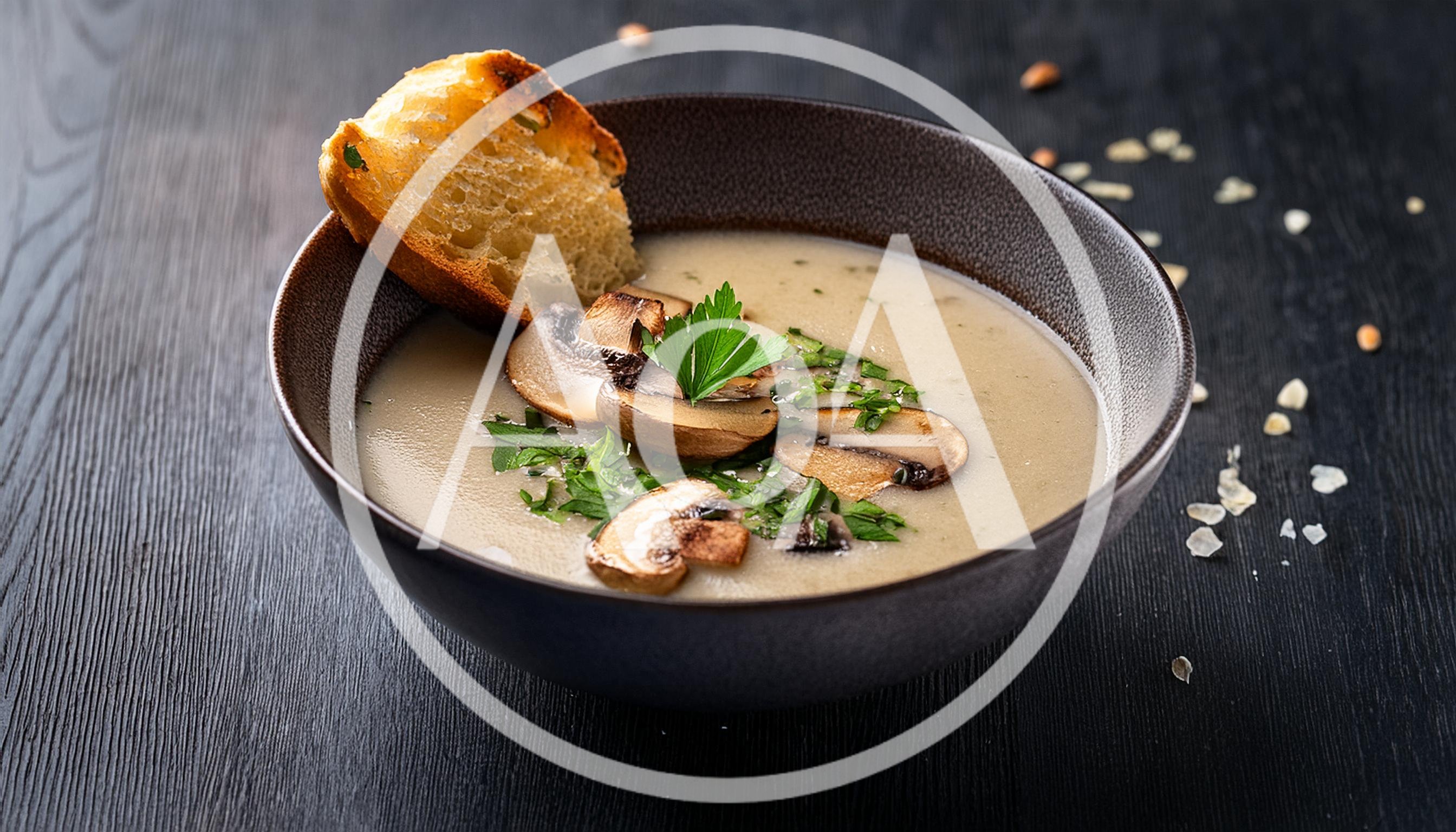 Creamy Mushroom Soup In A Dark Bowl