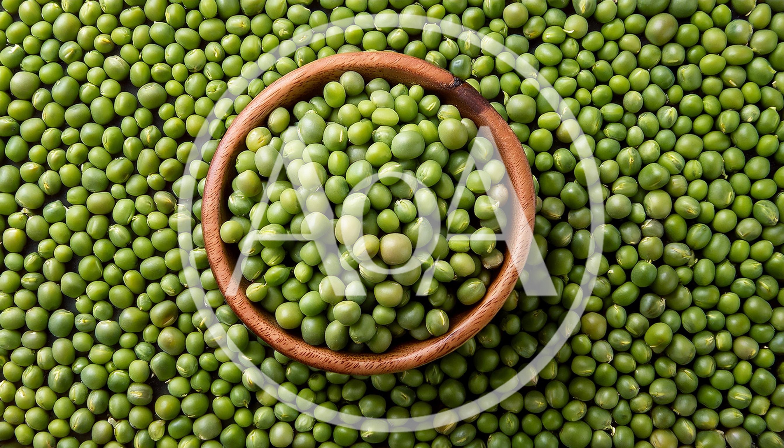 Wooden Bowl Filled With Fresh Green Peas
