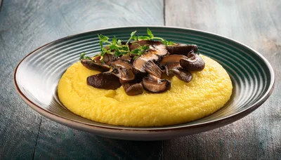 Creamy Polenta Topped With Sautéed Mushrooms And Thyme