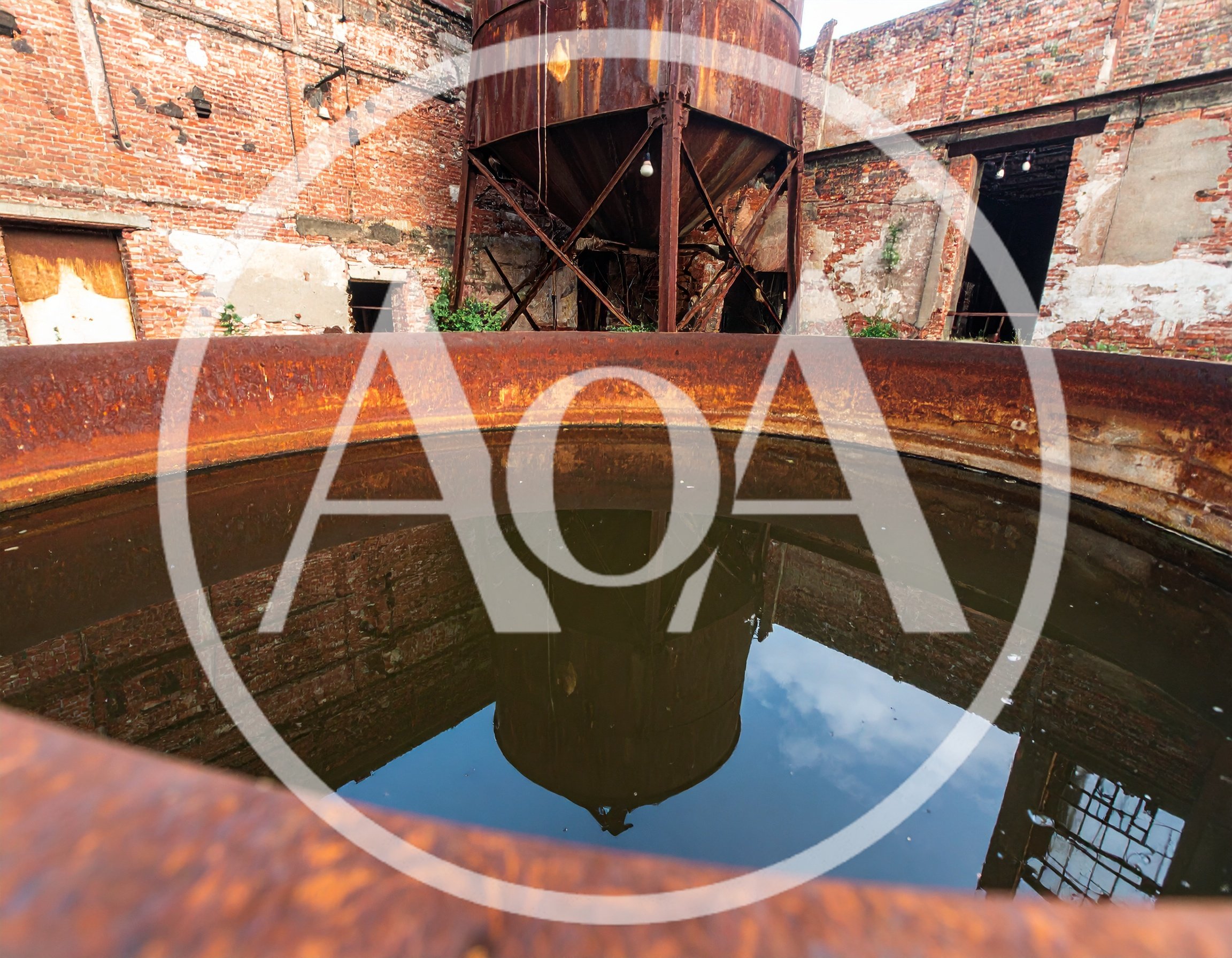 Abandoned Industrial Site With Rusty Metal Tank