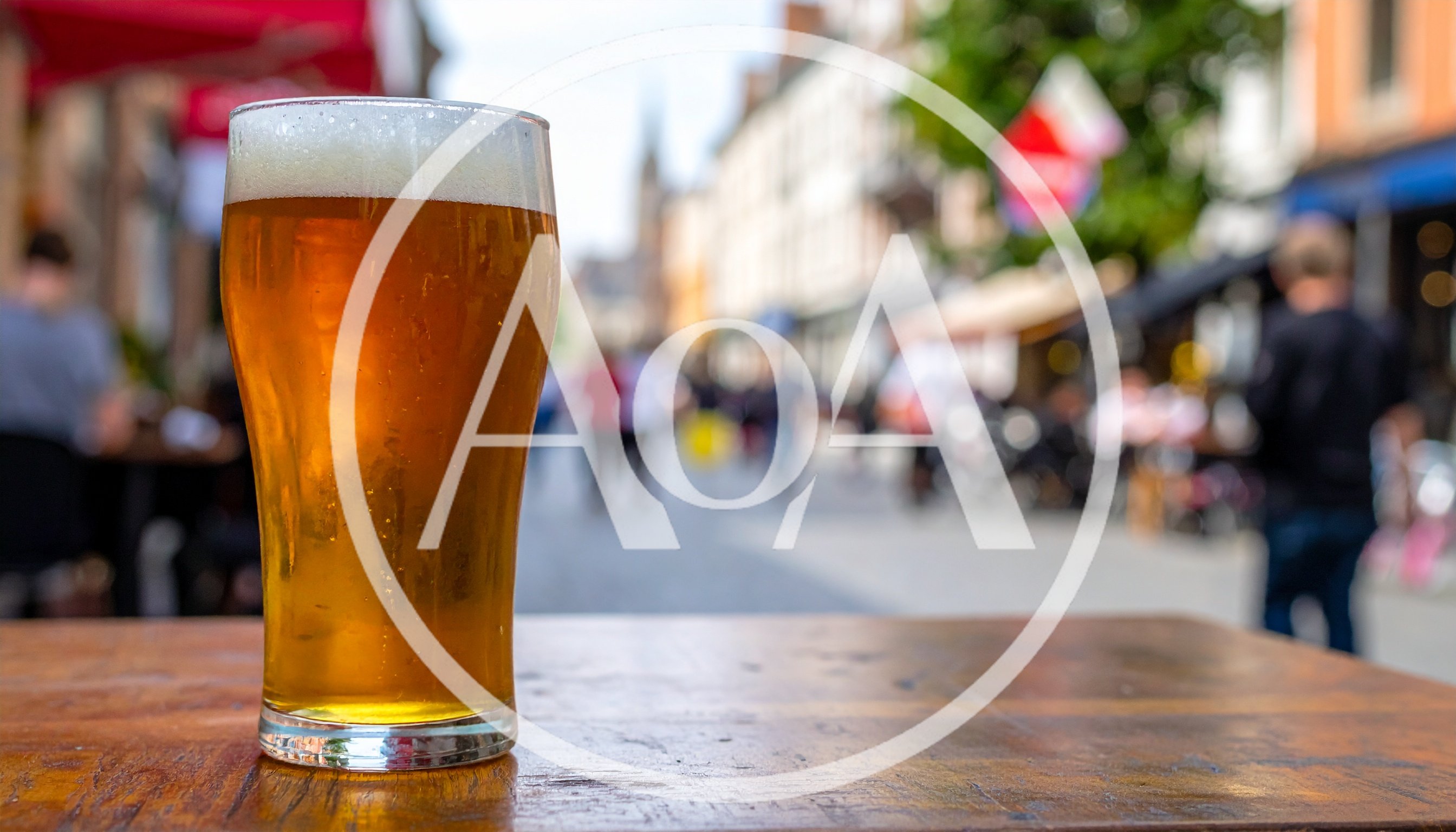 Glass Of Beer On A Table In A Busy Street