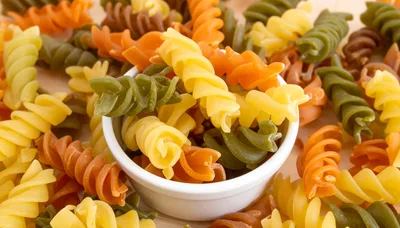Colorful Rotini Pasta In A White Bowl