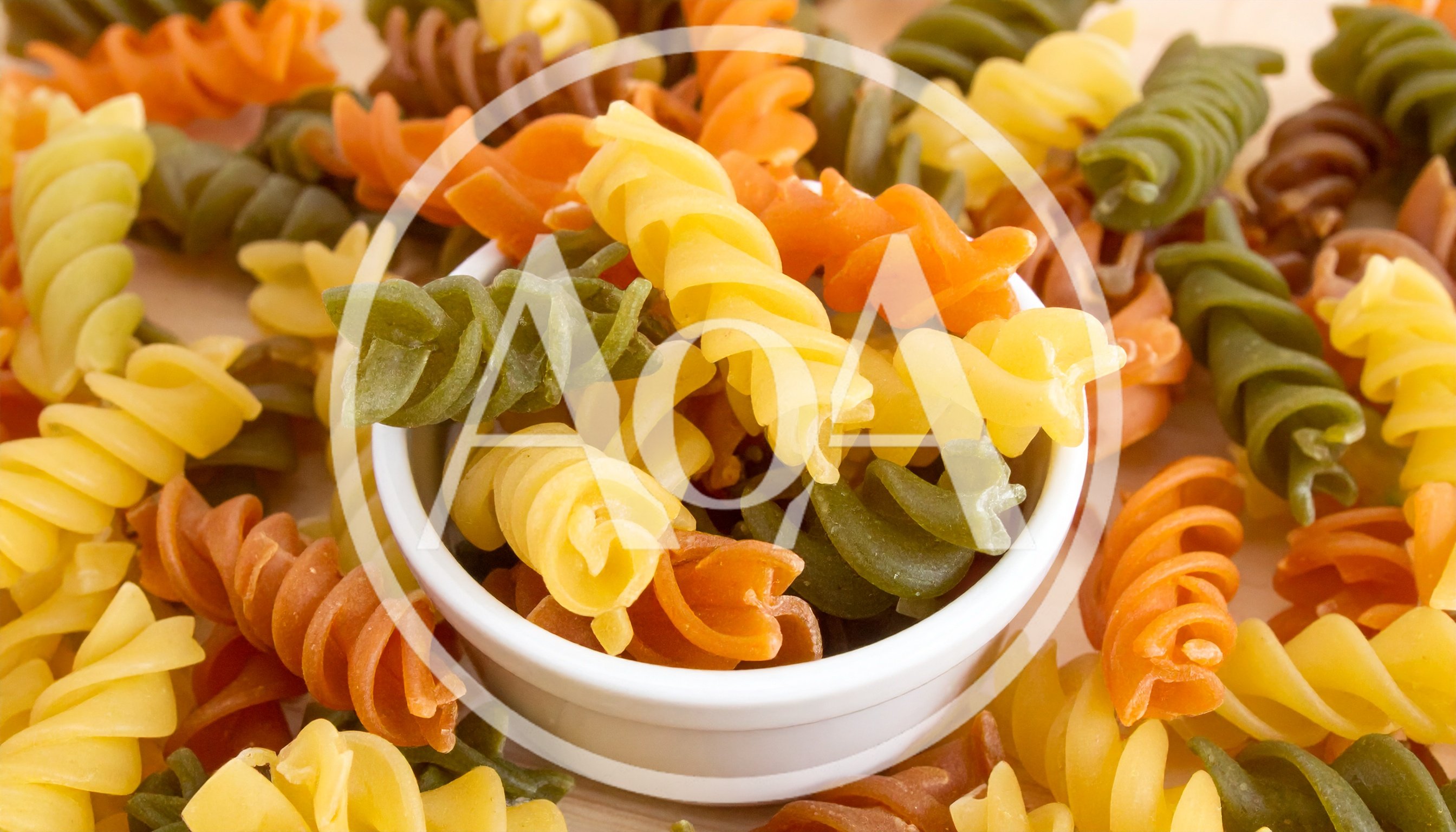 Colorful Rotini Pasta In A White Bowl