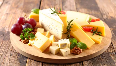 Assorted Cheese Platter With Grapes And Walnuts
