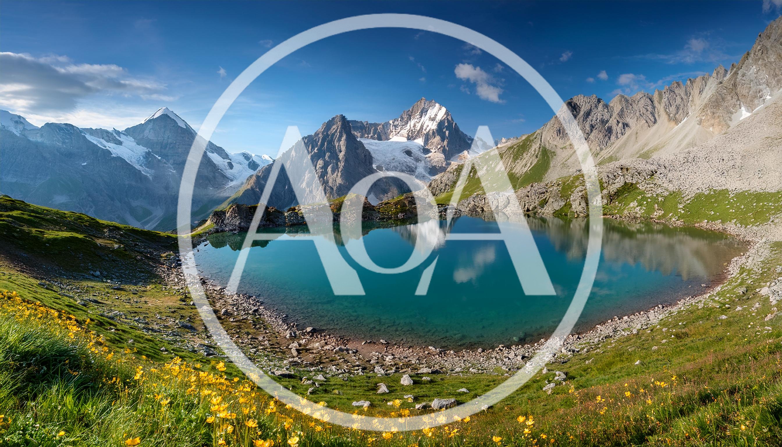 Alpine Lake Reflection Under Snow Capped Mountain Peaks