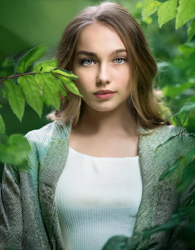 Portrait of a Young Woman Surrounded by Lush Greenery