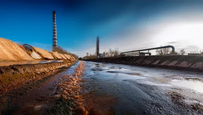 Industrial Wastewater Flowing Through A Concrete Canal