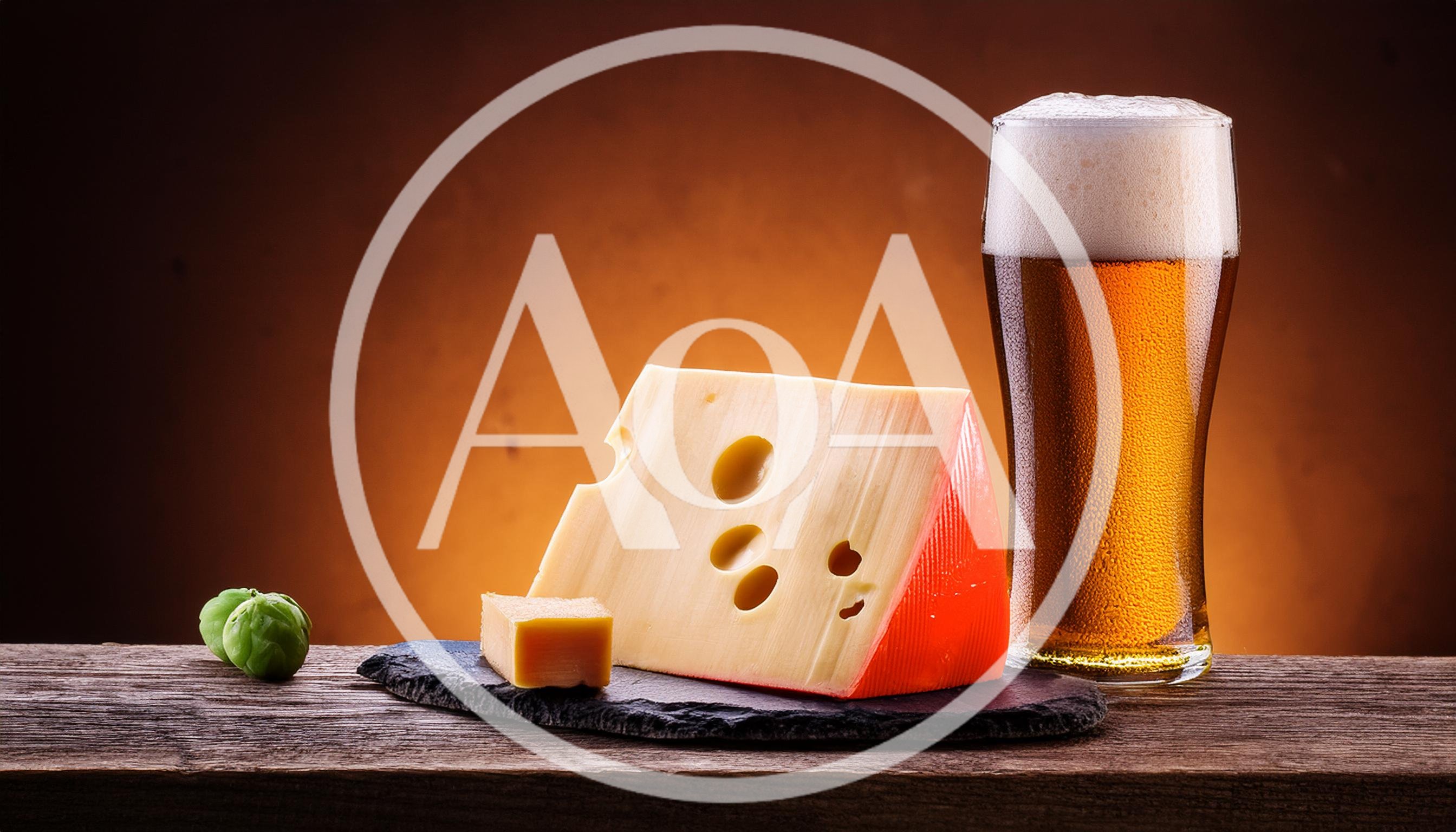 Wedge of Swiss Cheese and Glass of Beer