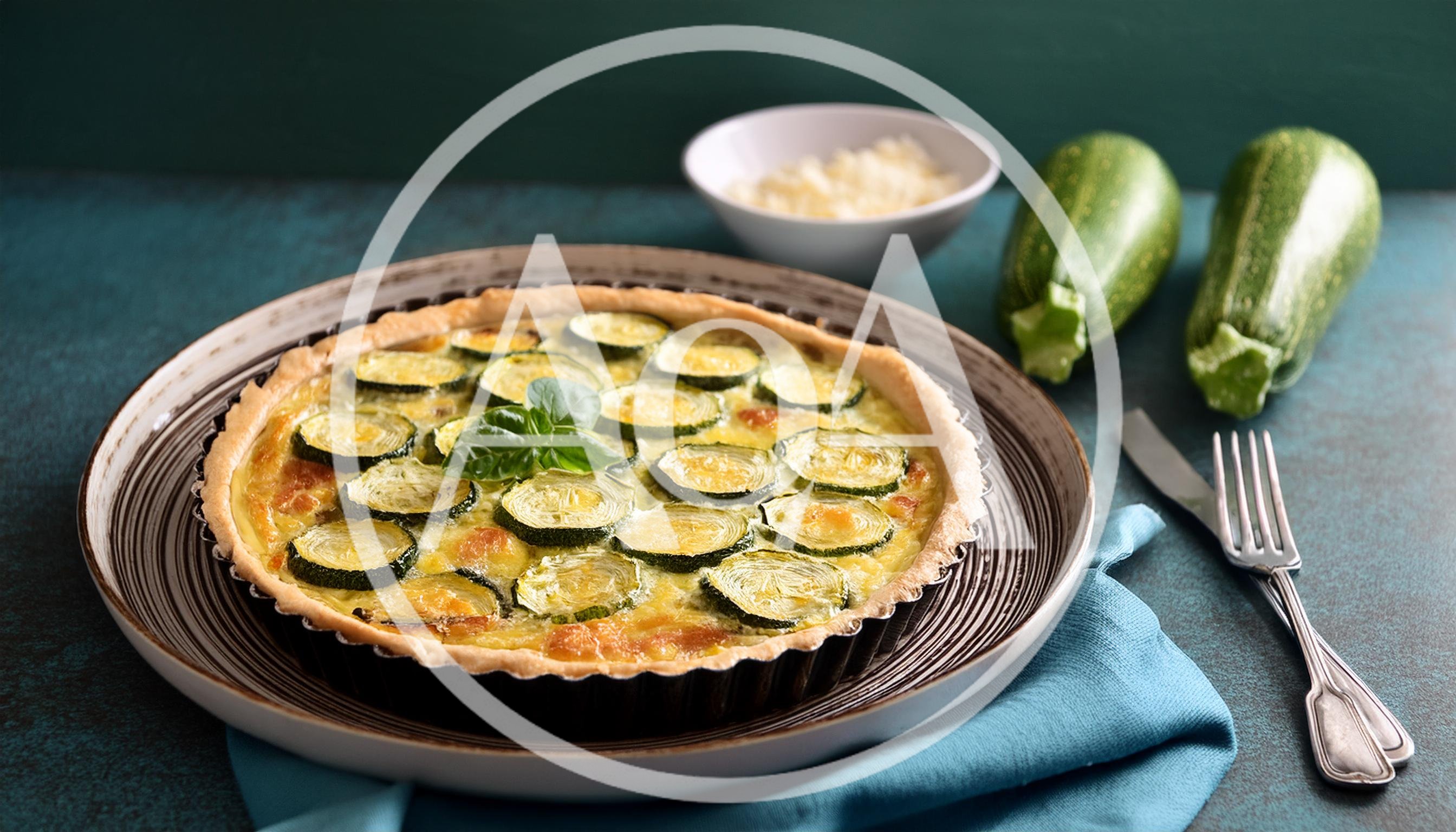 Freshly Baked Zucchini Quiche on a Rustic Plate