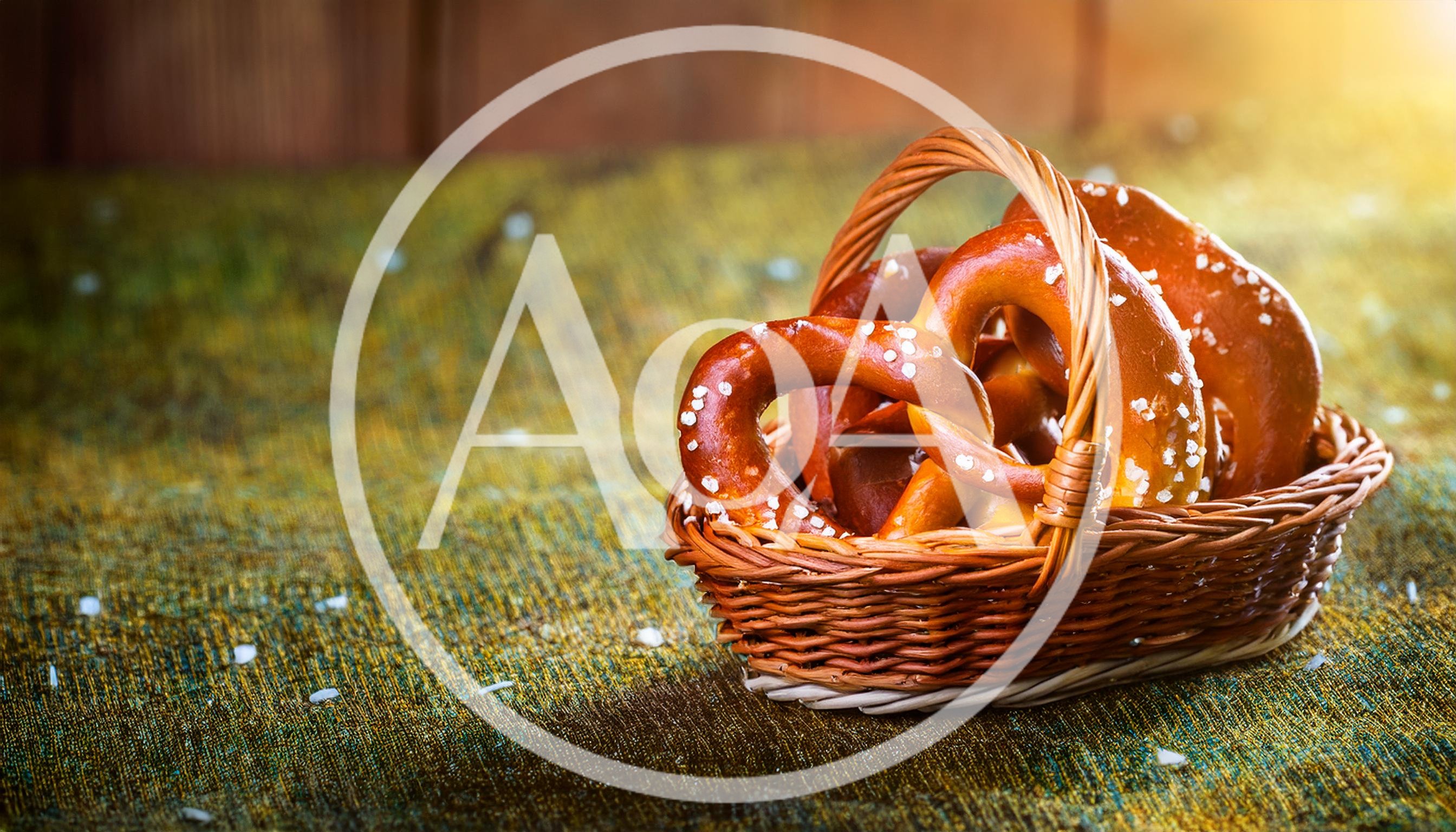 Freshly Baked Salted Pretzels In A Wicker Basket