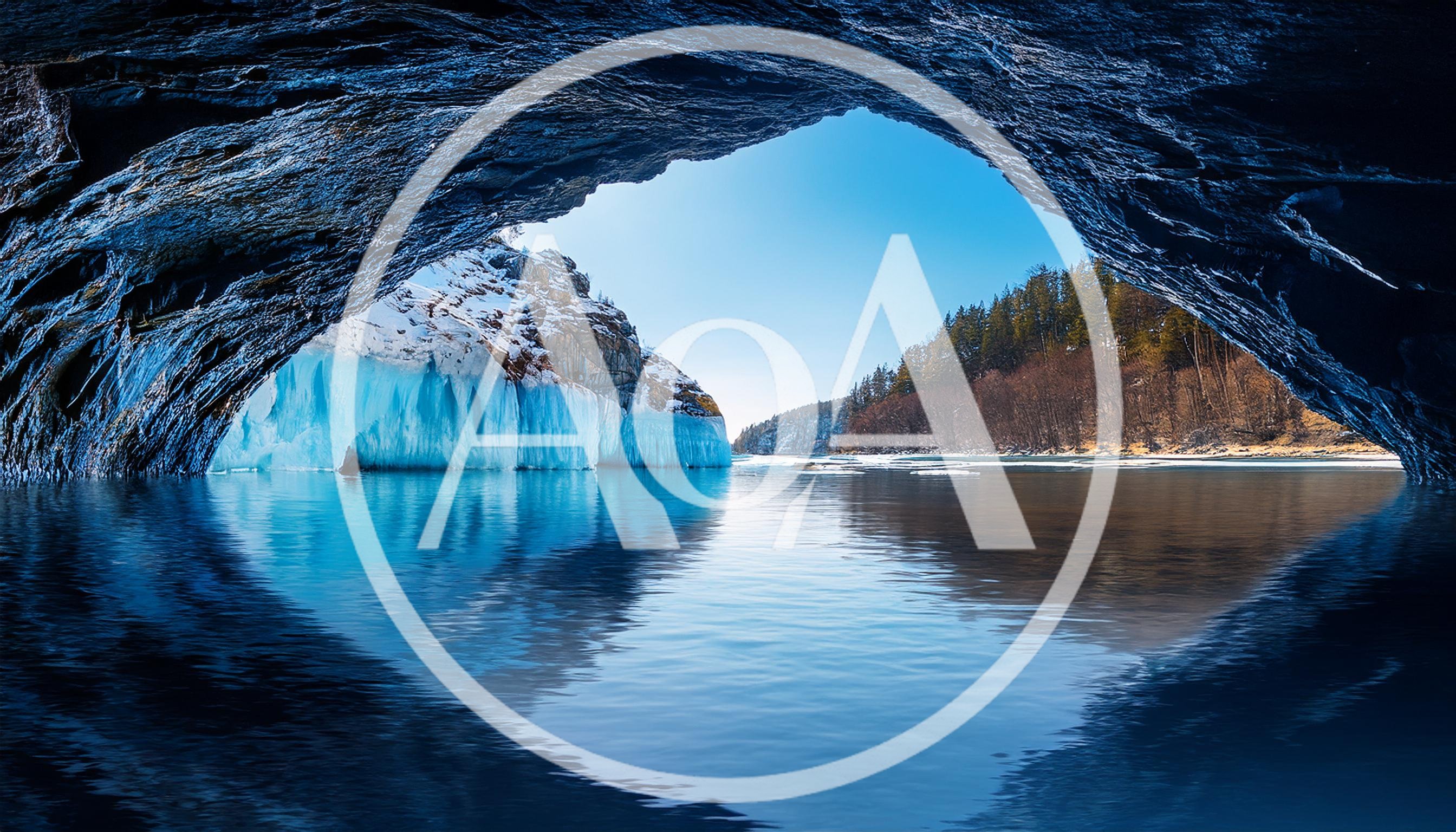 Ice Cave Opening Overlooking A Frozen Lake