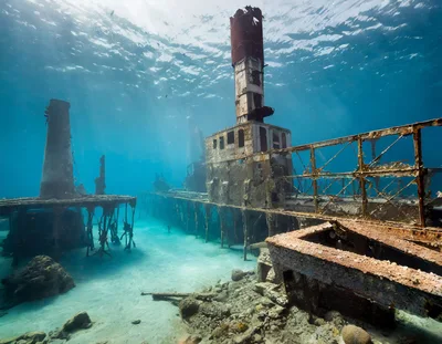 Underwater View Of A Sunken Shipwreck In Clear Water