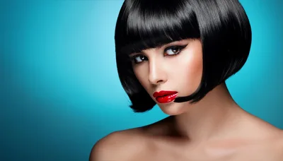 Portrait Of A Woman With A Black Bob Hairstyle