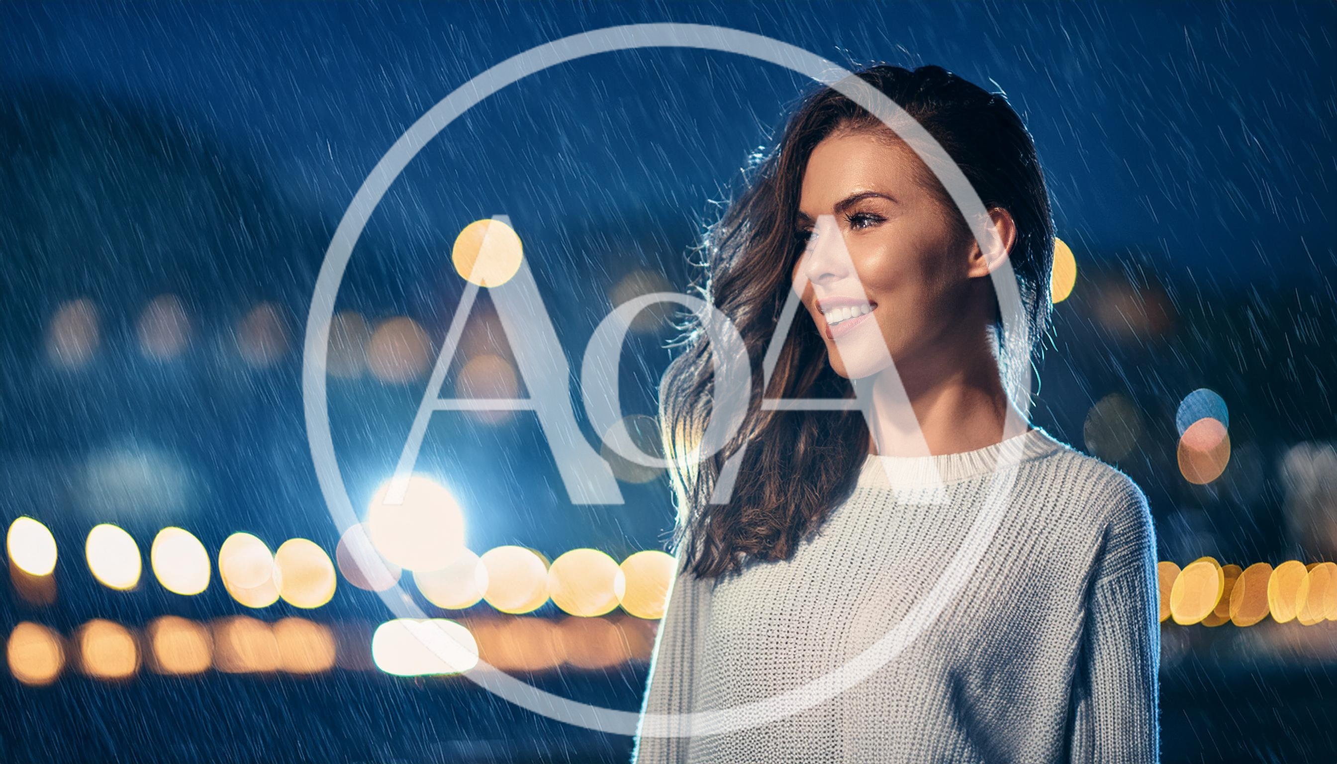 Smiling Young Woman Standing Outside During Night Rain