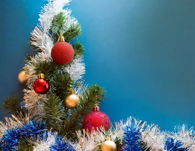 Christmas Tree Decorated With Red And Gold Ornaments