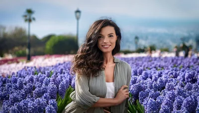 Beautiful Woman Posing In A Field Of Purple Hyacinths