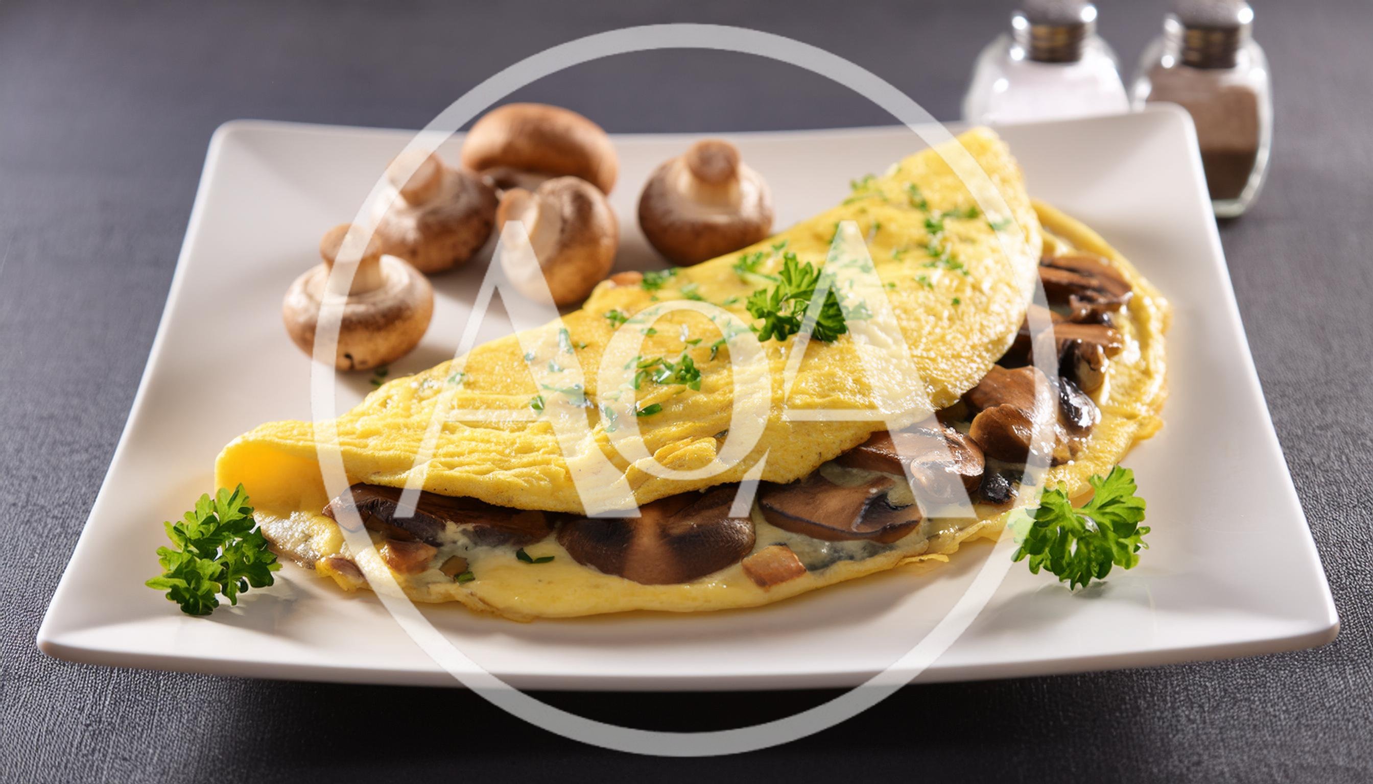 Mushroom Omelet Served On A White Plate
