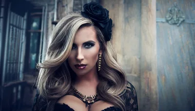 Portrait Of A Glamorous Woman With A Black Rose