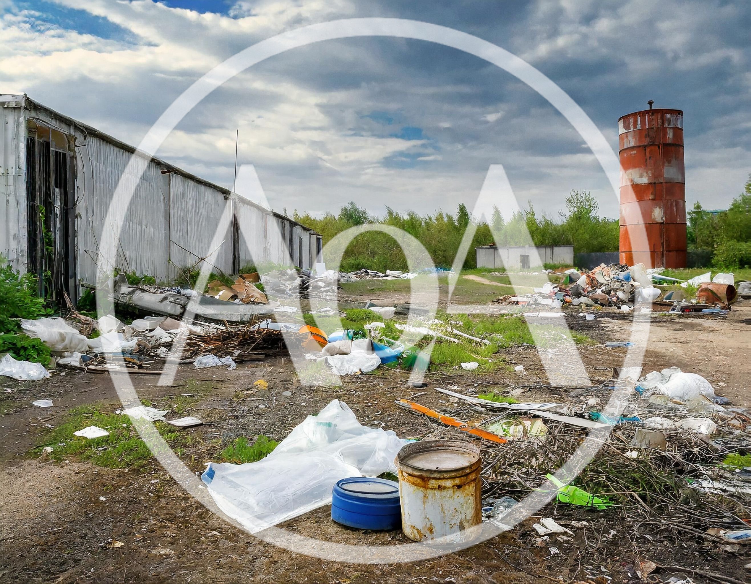 Abandoned Industrial Site With Debris And Rusty Silo