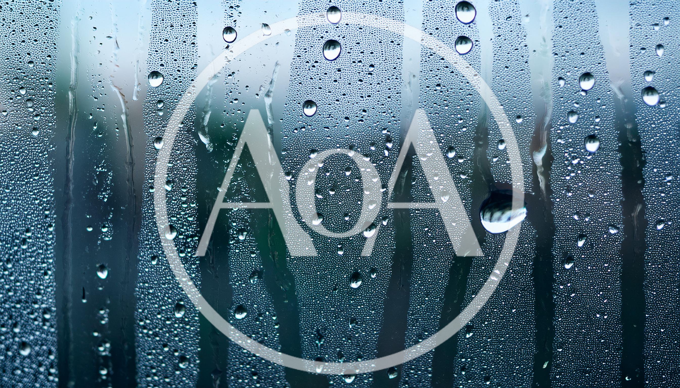 Condensation Droplets Running Down A Glass Window Pane