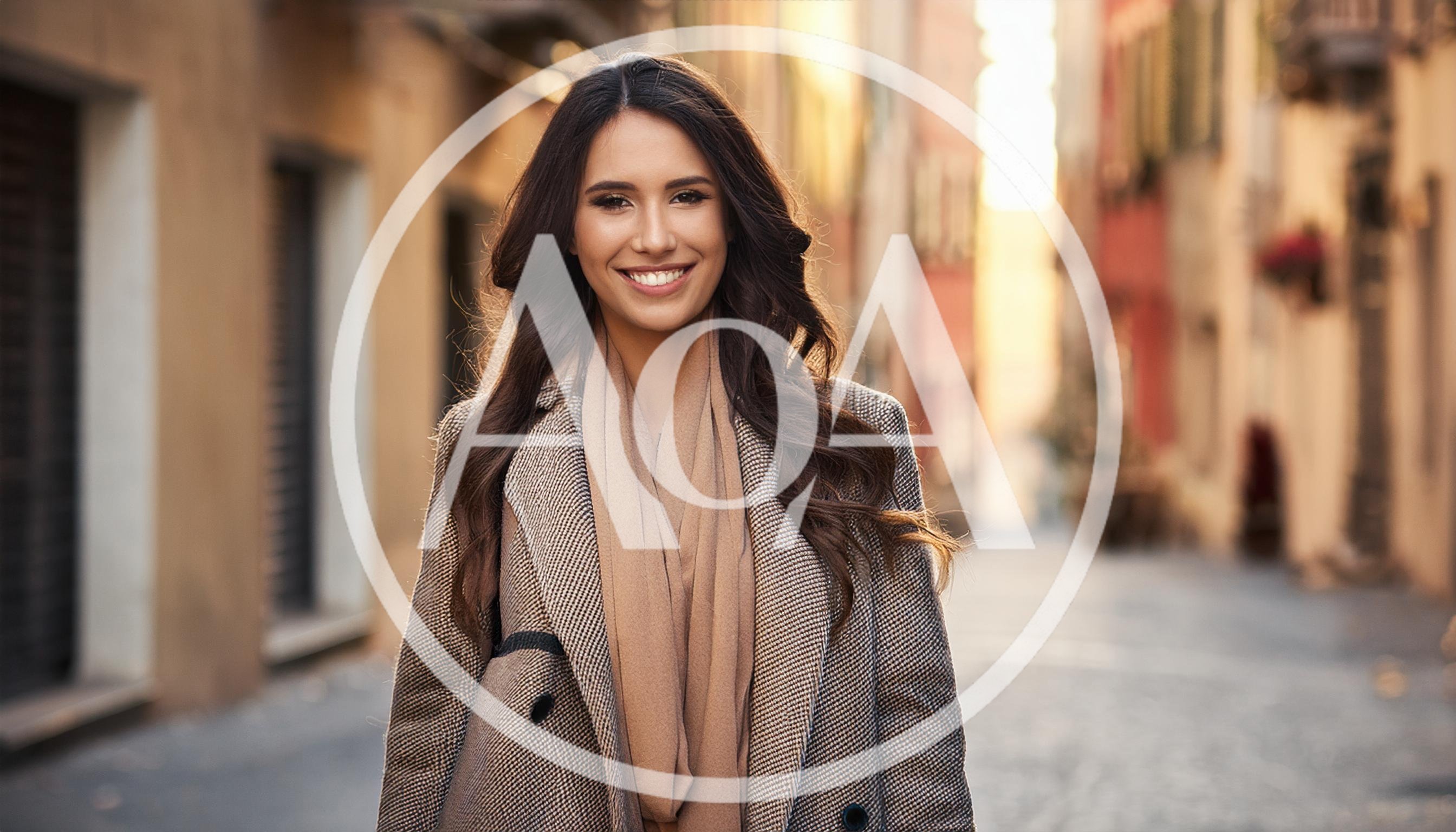 Smiling Young Woman Walking Through A European Street
