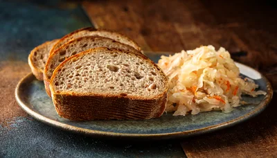Slices Of Rye Bread With Sauerkraut On A Plate