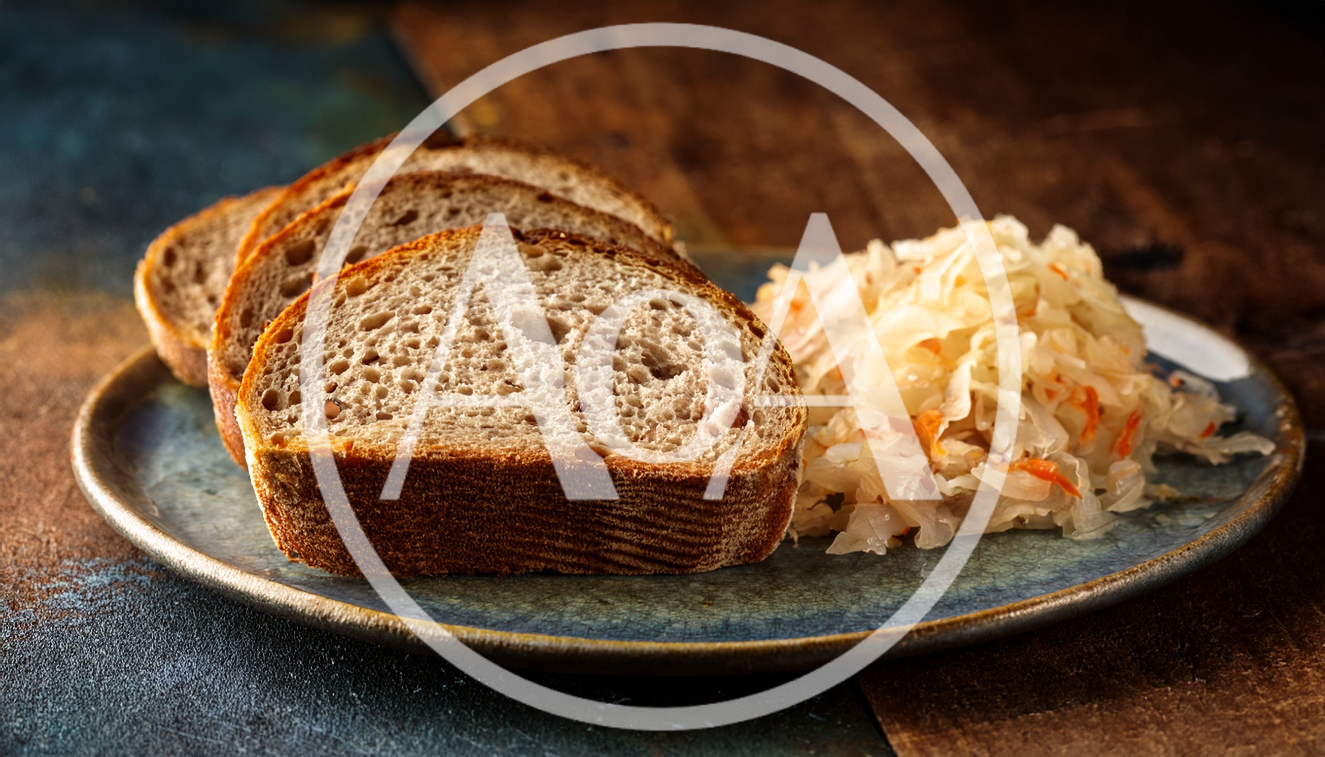 Slices Of Rye Bread With Sauerkraut On A Plate