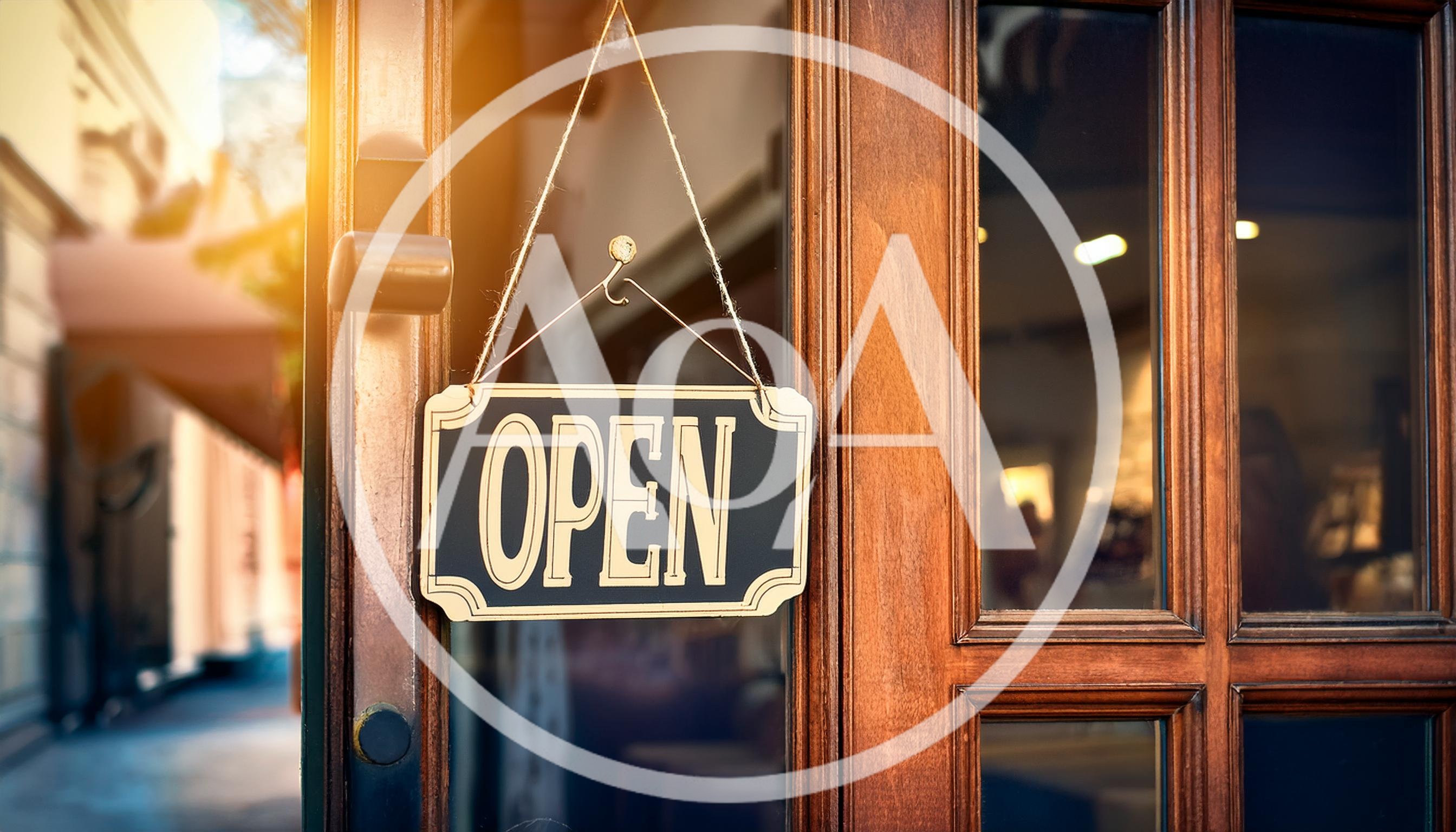 Open Sign Hanging On A Wooden Storefront Door