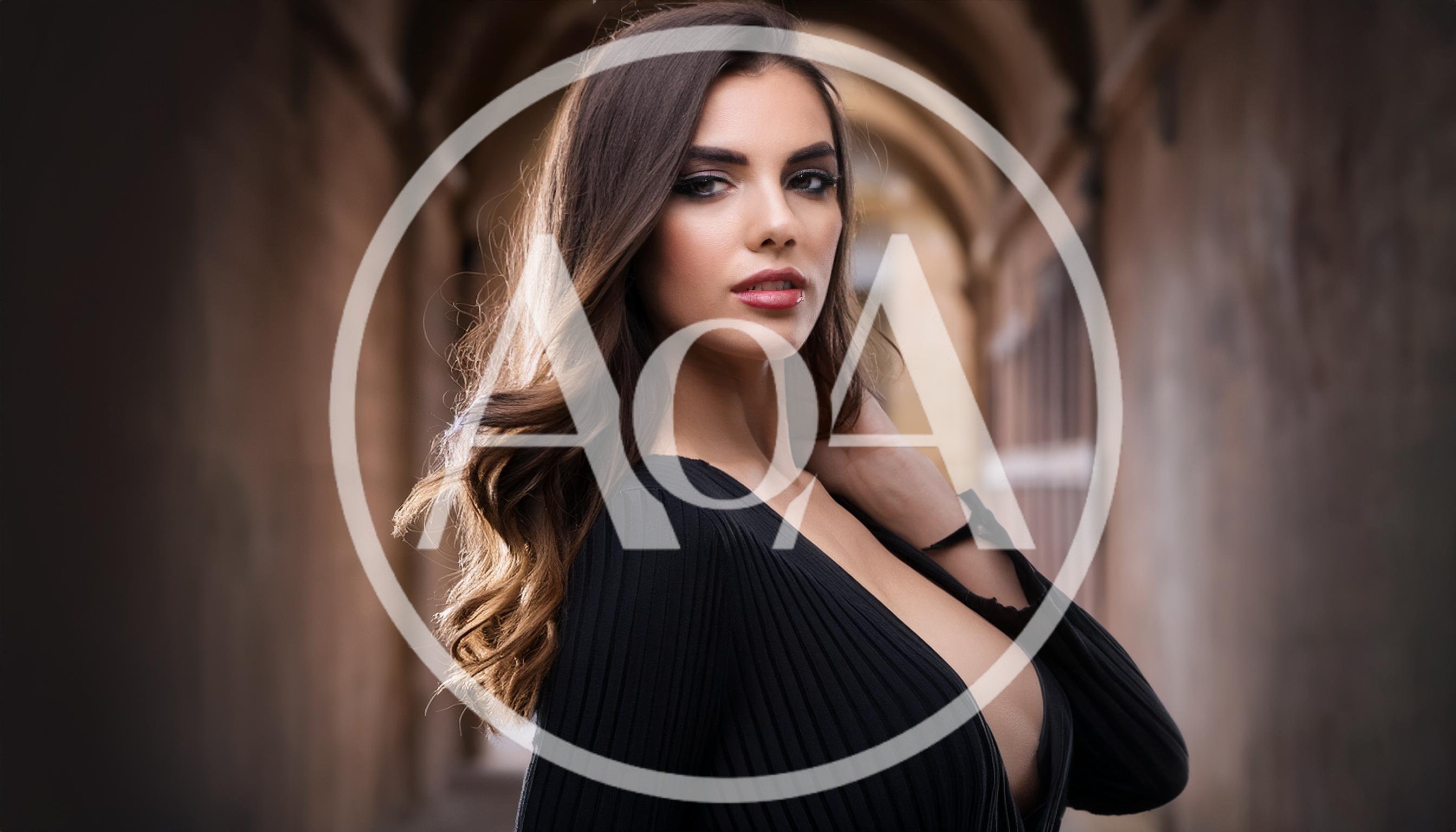 Portrait Of A Beautiful Woman In A Black Dress