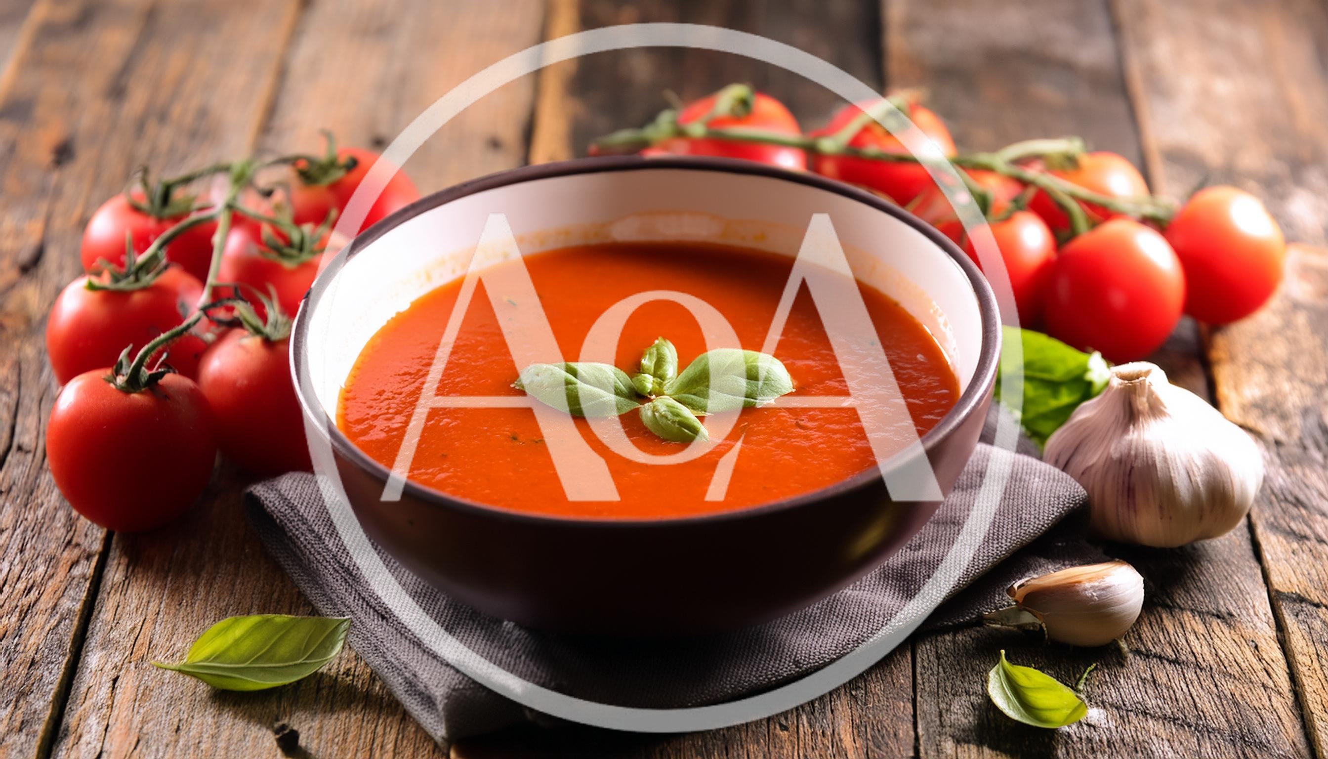 Bowl Of Tomato Soup With Fresh Basil And Garlic