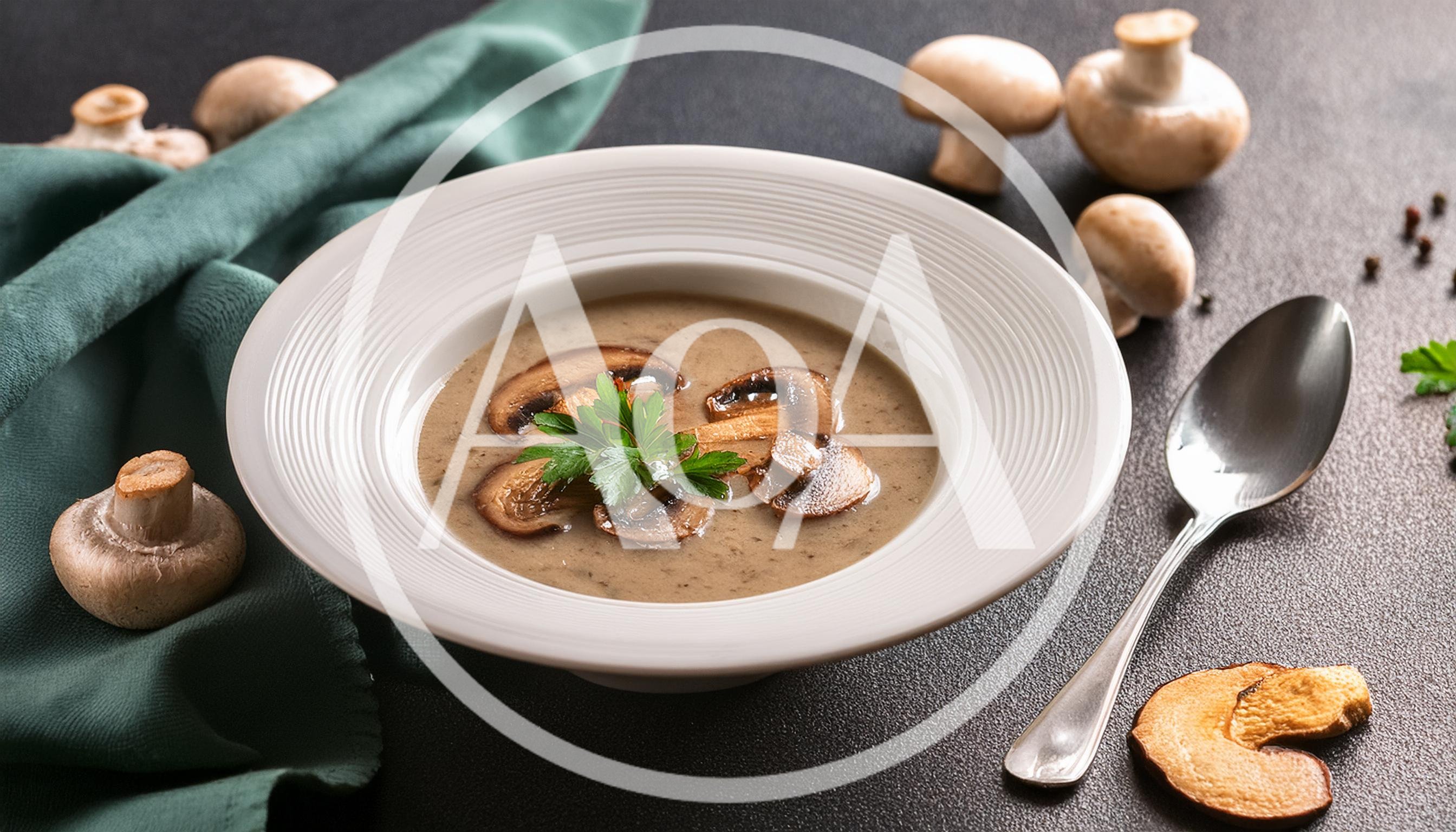 Creamy Mushroom Soup Served In A White Bowl